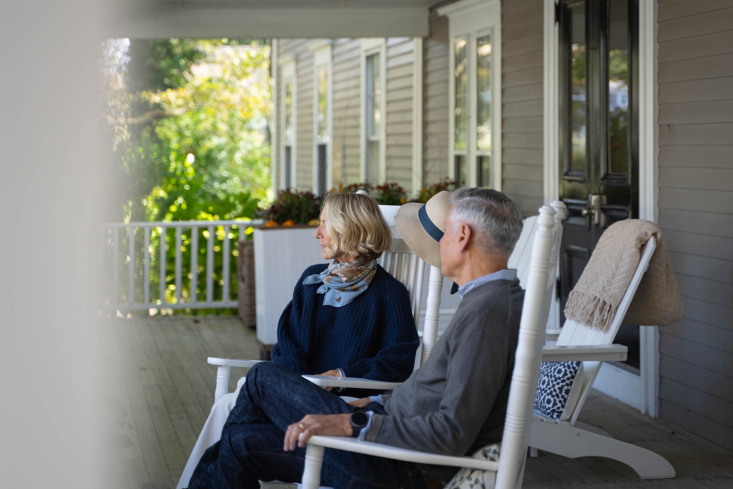 A couple sitting on the deck of the Chatham Inn