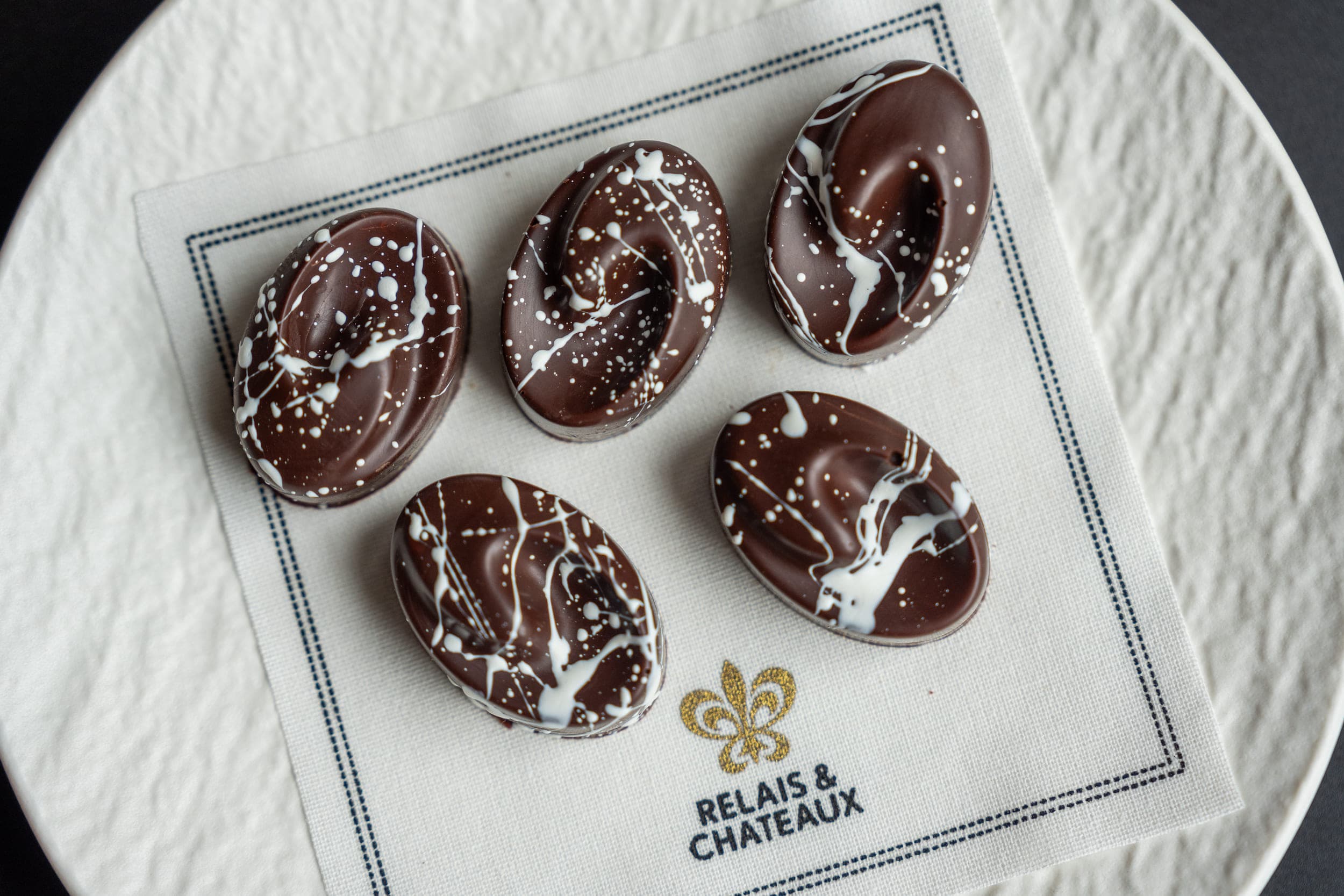 A tray of 5 chocolates at Relais & Chateaux