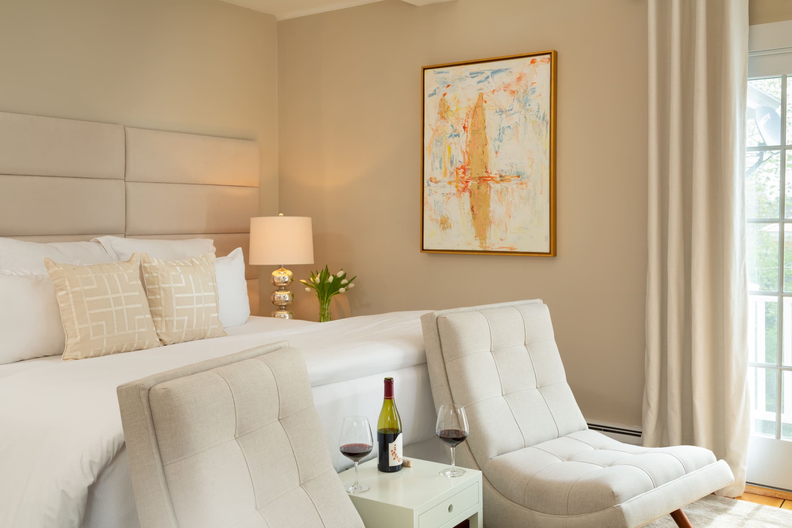 A room at the Chatham Inn with local art hanging on the walls