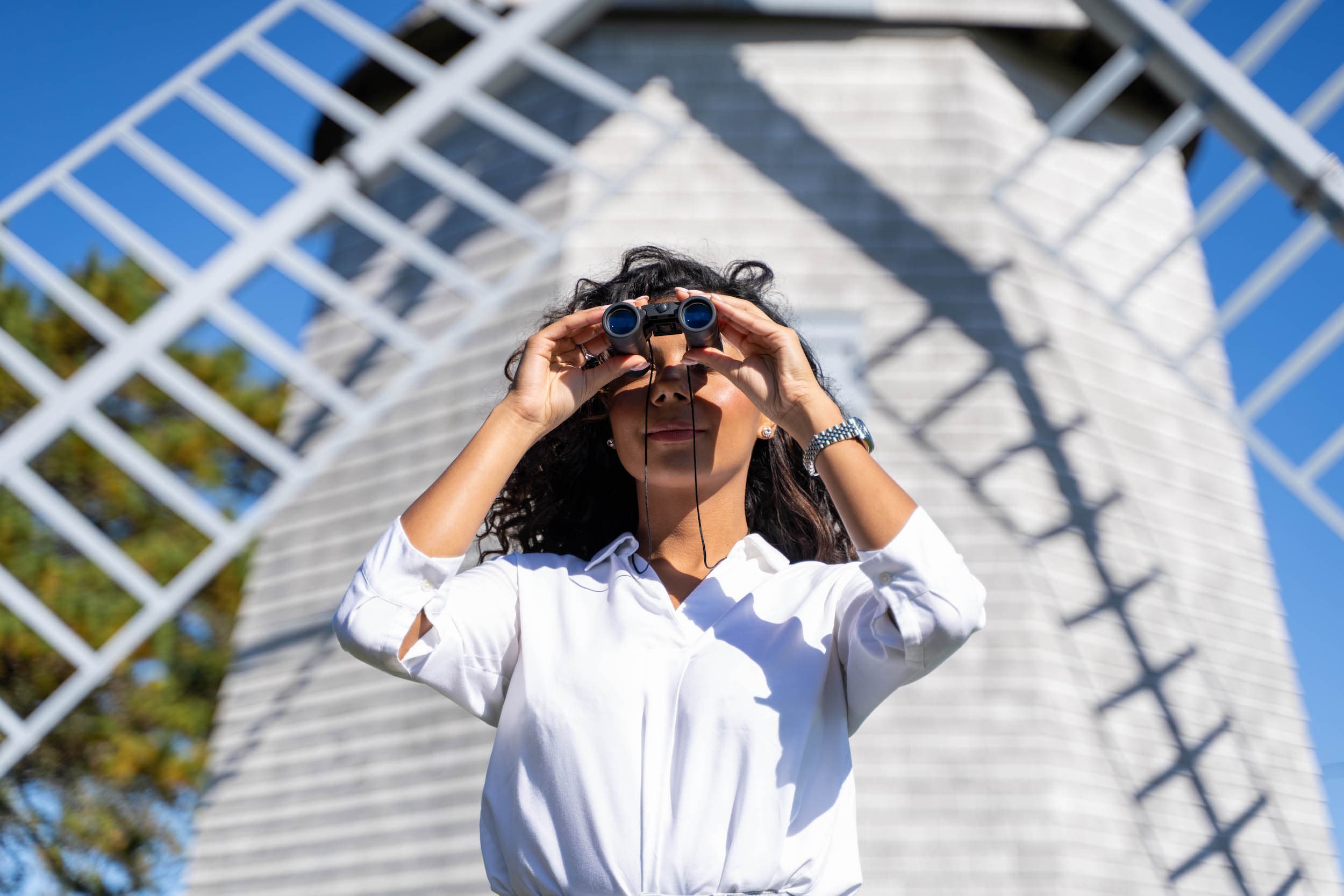 A woman using a pair of binoculars