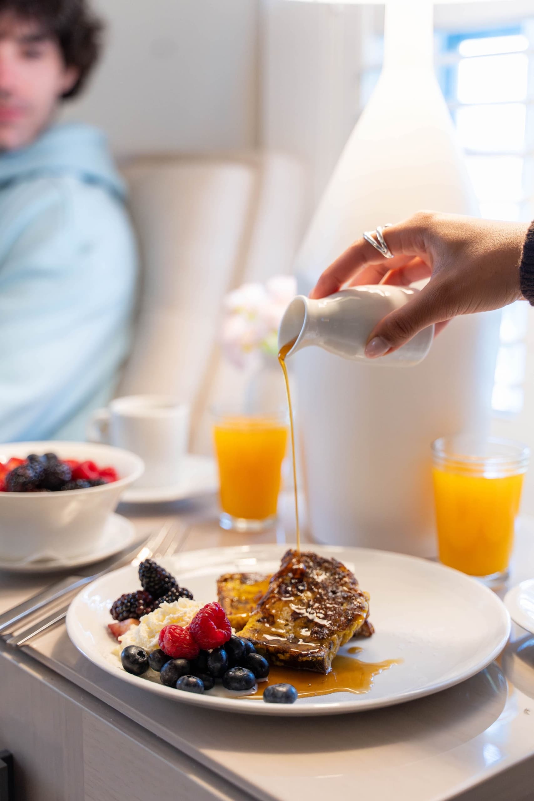 French toast and granola with berries on teh in-room table at Chatham Inn