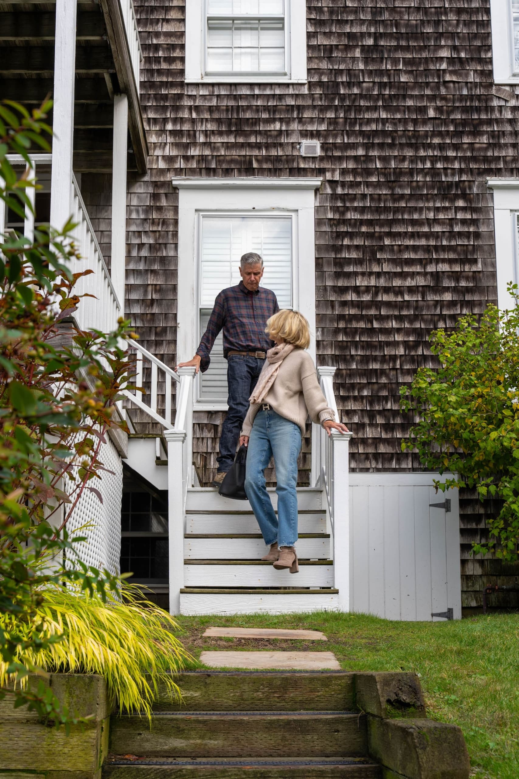 A couple leaving the Chatham Inn for a day adventure