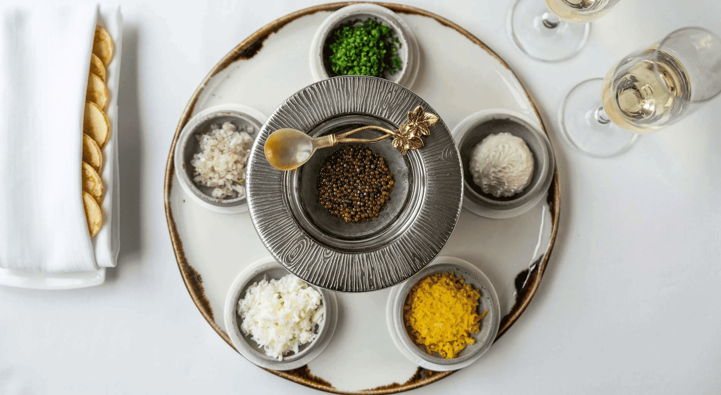 A beautiful dish with 6 different oyster toppings, including caviar at Chatham Inn