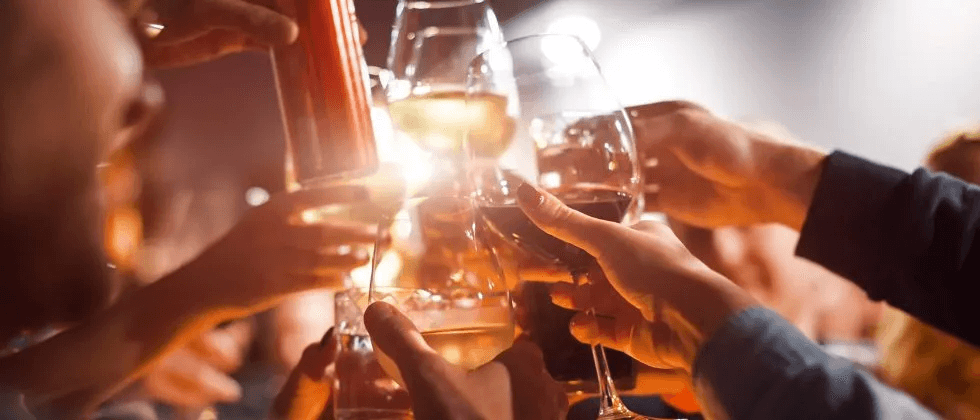 People celebrating by cheers-ing