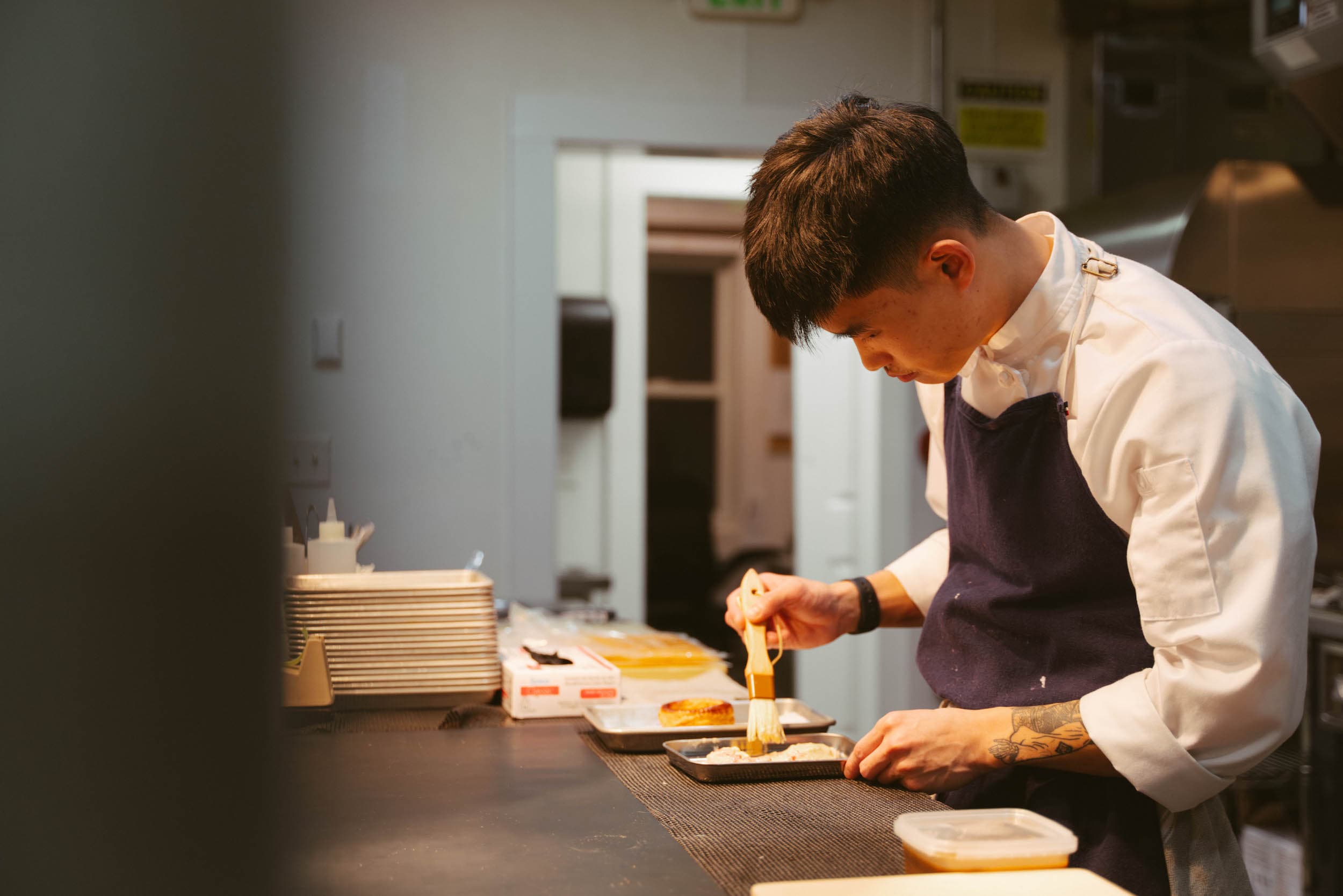 A chef preparing a dish at The Chatham Inn for Forbes Five Star Story