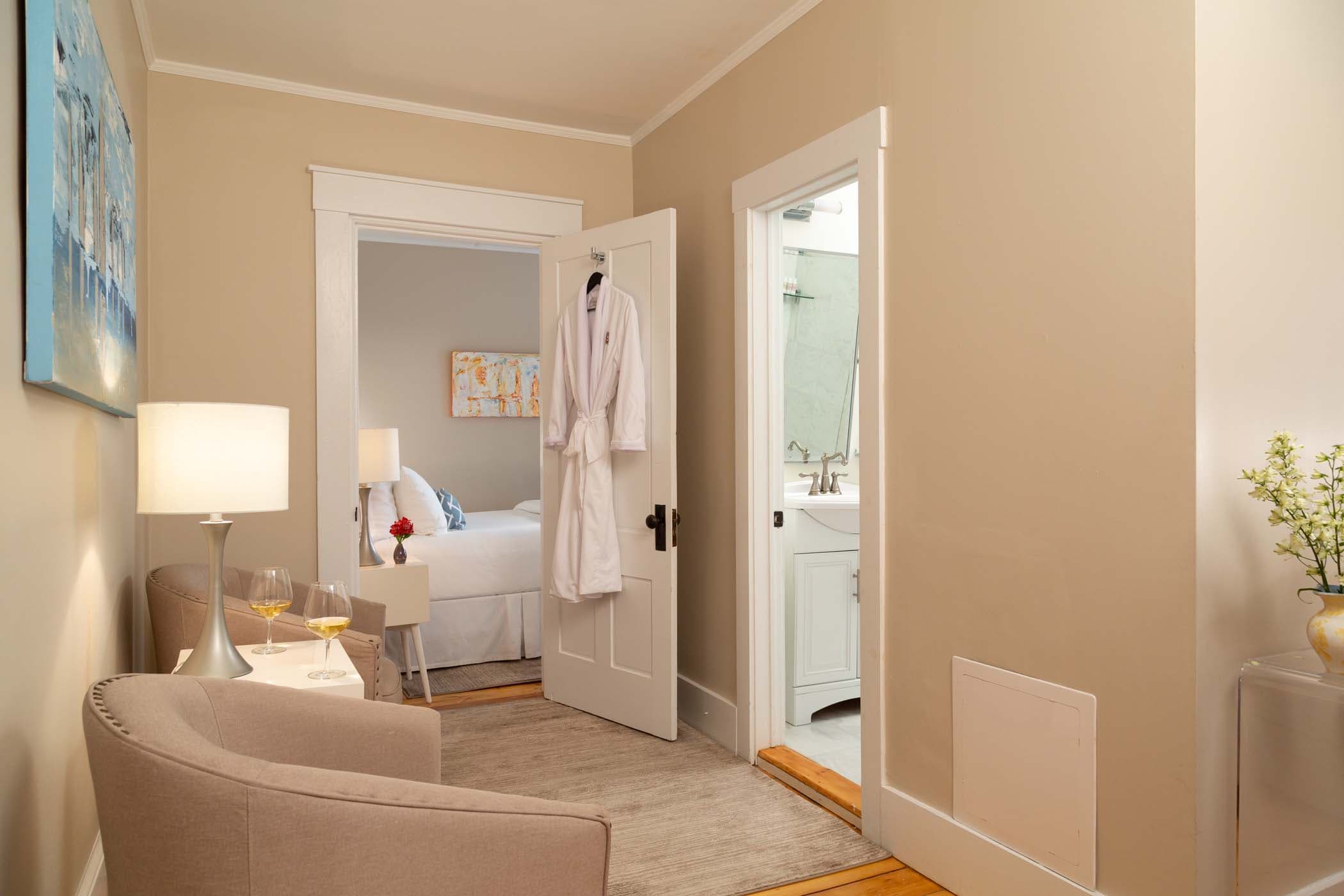 The hallway area leading to the bedroom, and bathroom of Room 15 at Chatham Inn