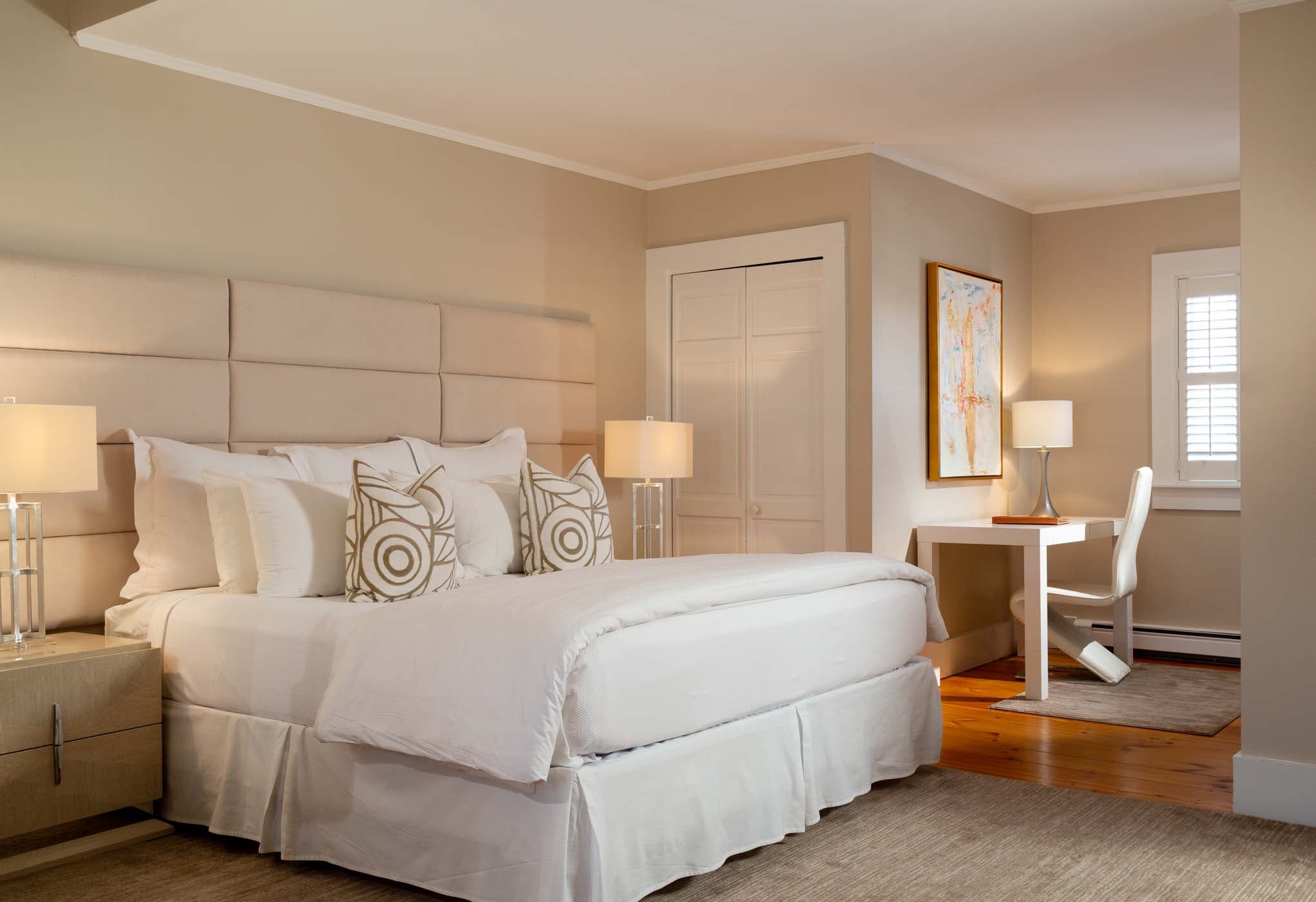 A king bed in a room at The Chatham Inn