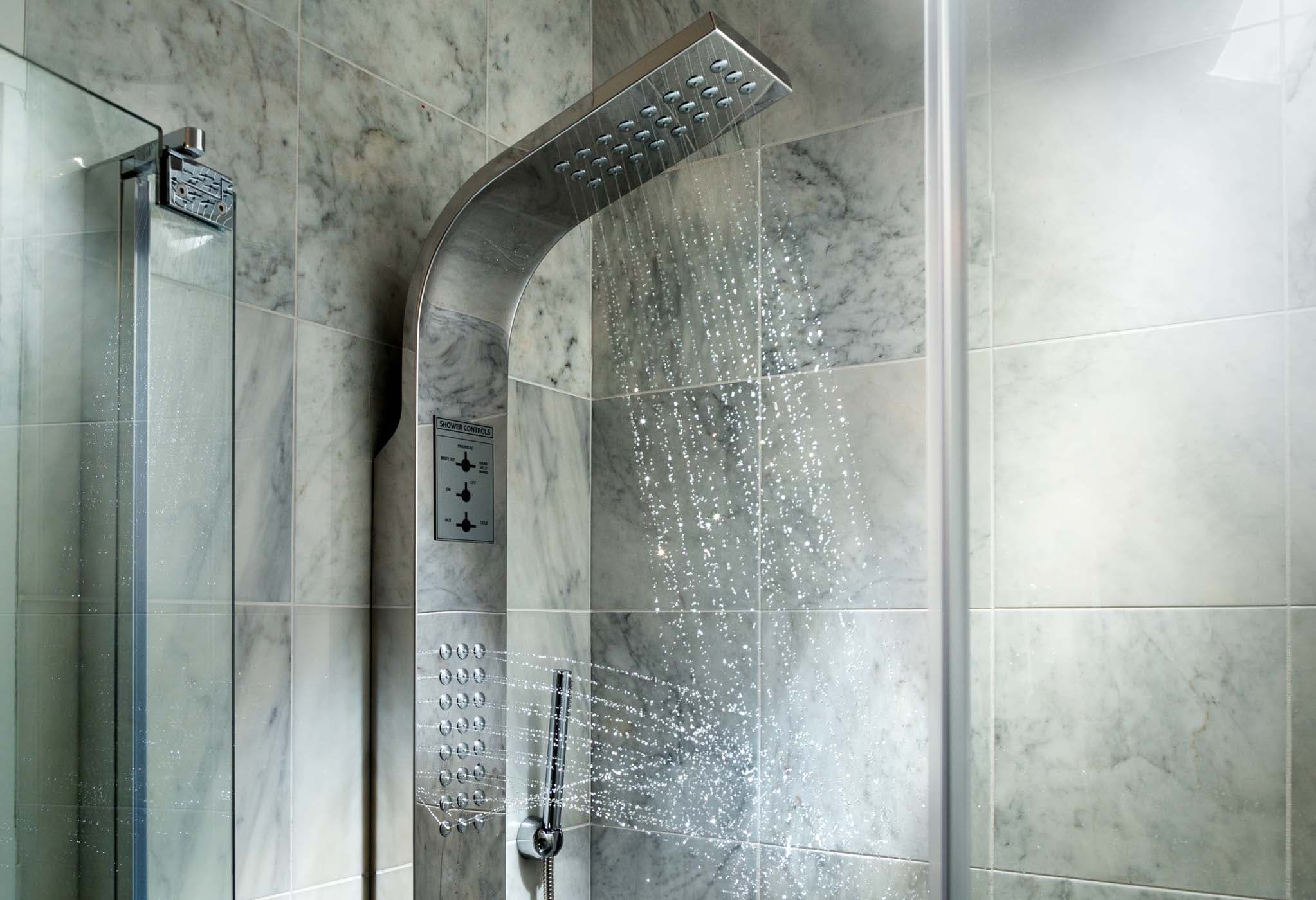 A modern shower head in a room 6 at Chatham Inn