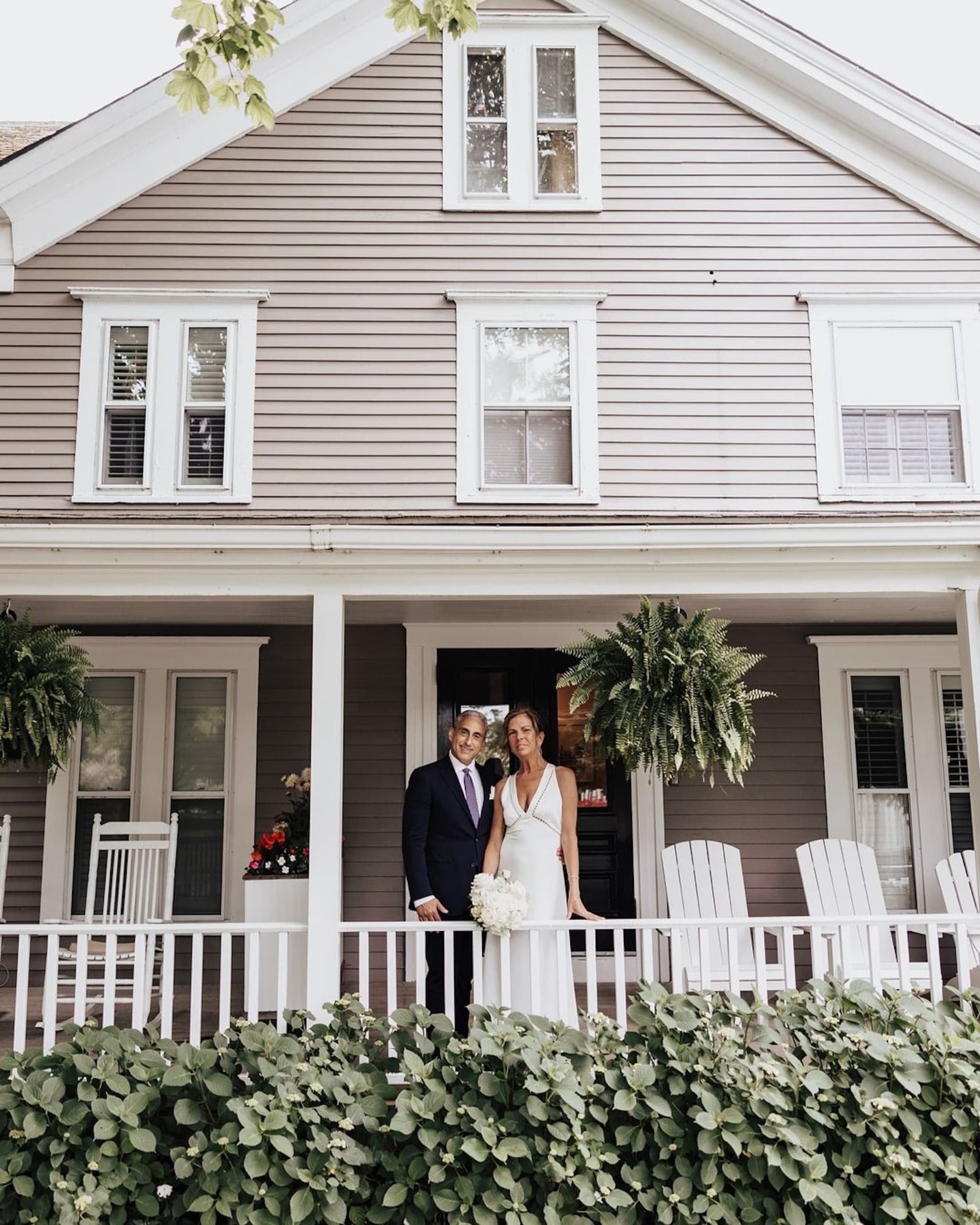 A married couple on a patio at Chatham Inn