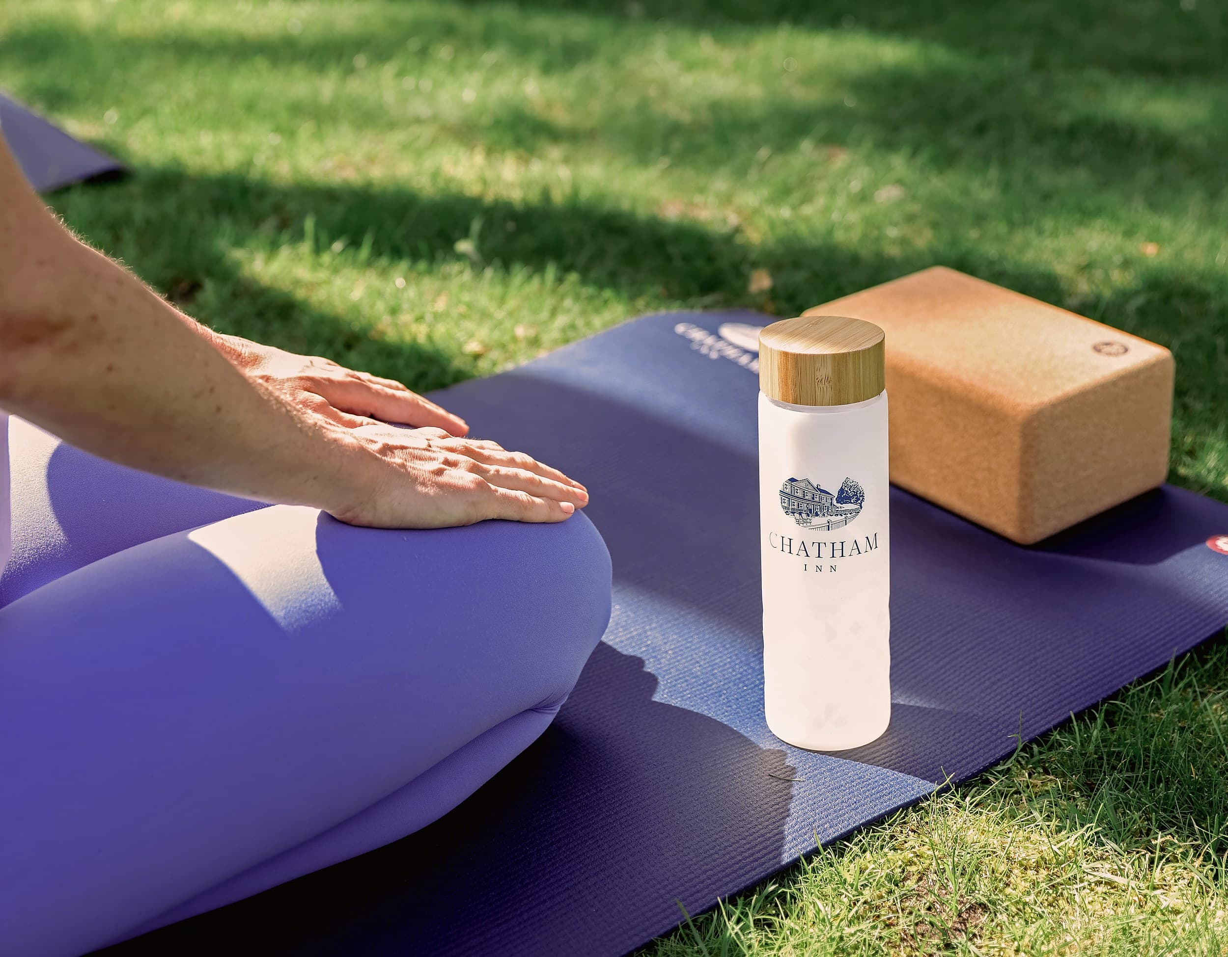 Outdoor yoga and wellness on the lawn at Chatham Inn, a Relais & Châteaux hotel in Chatham, Cape Cod, Massachusetts.