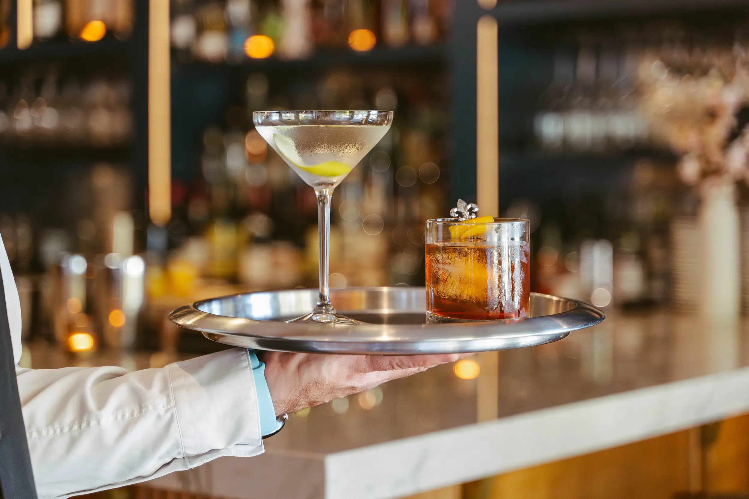 Hand-crafted martini and Old Fashioned cocktails at Cuvée bar inside Chatham Inn Relais & Châteaux on Cape Cod, Massachusetts.